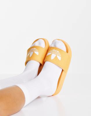 adidas Originals Adilette Lite sliders in hazy orange ASOS