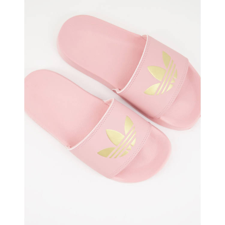 adidas Originals Adilette lite sliders in pink with gold trefoil