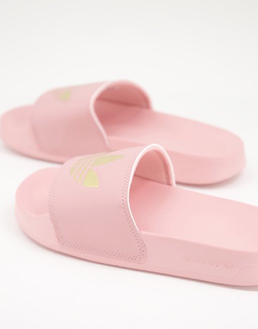 adidas Originals Adilette lite sliders in pink with gold trefoil