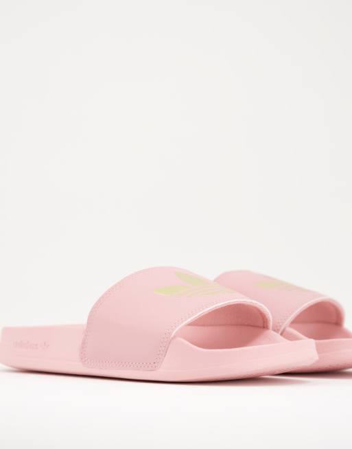 adidas Originals Adilette lite sliders in pink with gold trefoil