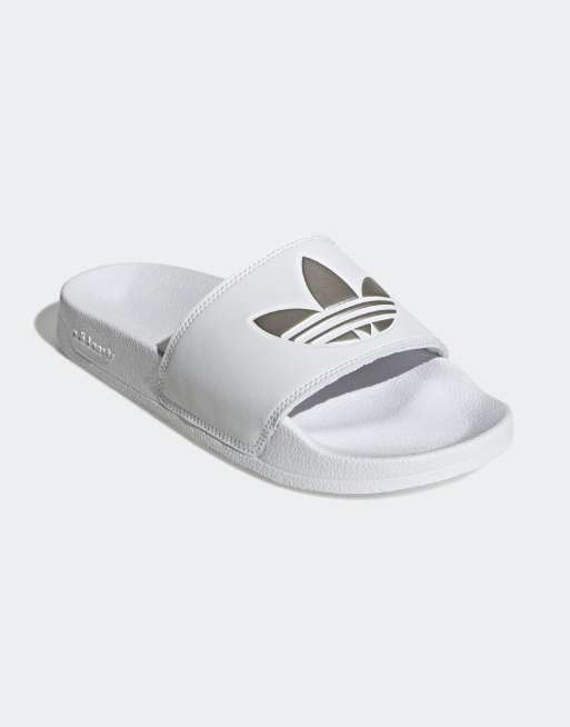 adidas Originals Adilette Lite Trefoil sliders in white and silver