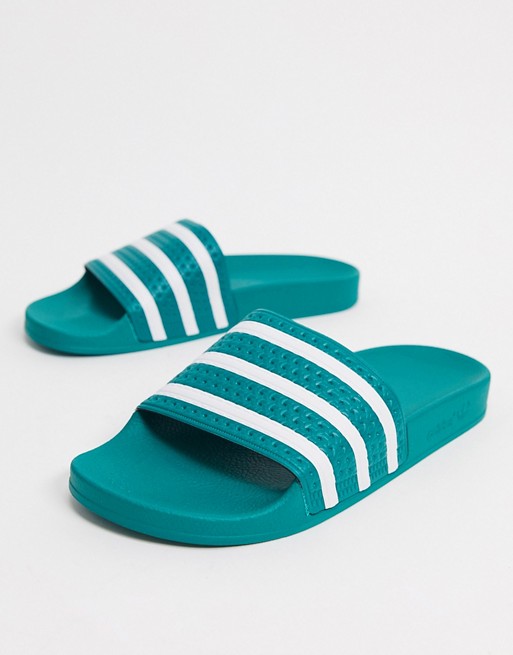 adidas Originals Adilette sliders in green and white