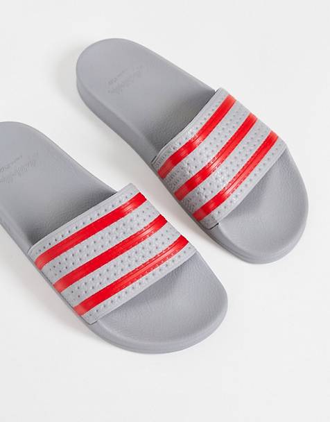 adidas Originals Adilette sliders in grey and red