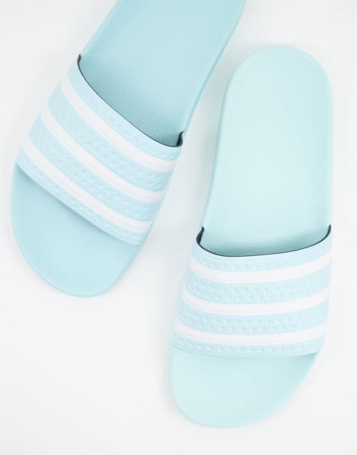 adidas Originals Adilette sliders in light blue ASOS