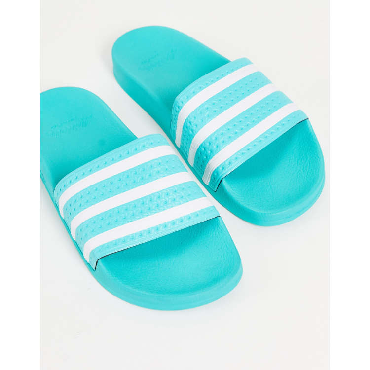 adidas Originals Adilette sliders in teal