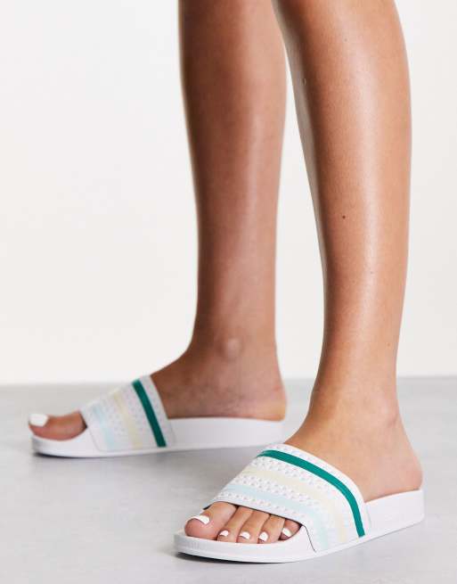 adidas Originals Adilette sliders in white with coloured three stripes