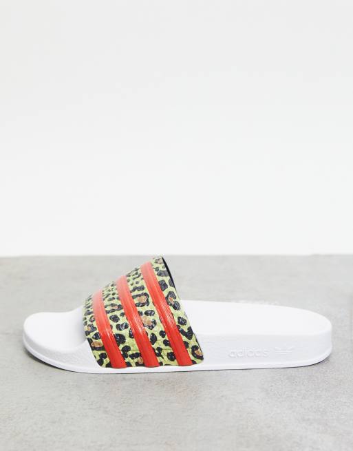 adidas Originals Adilette sliders in white with leopard print