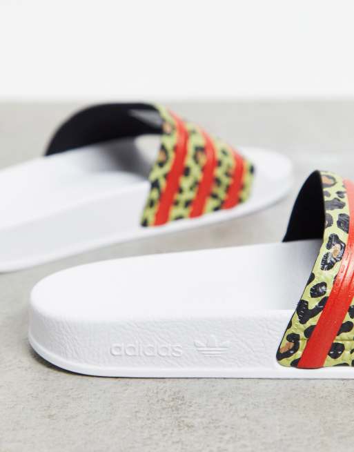 adidas Originals Adilette sliders in white with leopard print ASOS