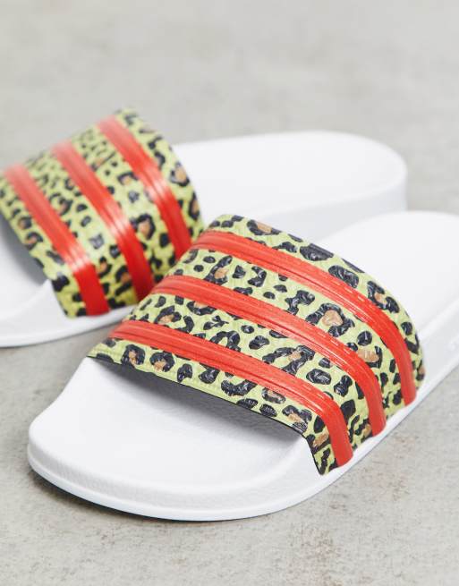 adidas Originals Adilette sliders in white with leopard print