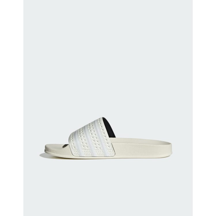 adidas Originals Adilette sliders in white