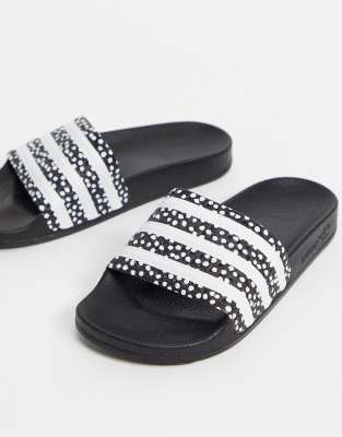 adidas Originals Adilette slides in black with polka dots