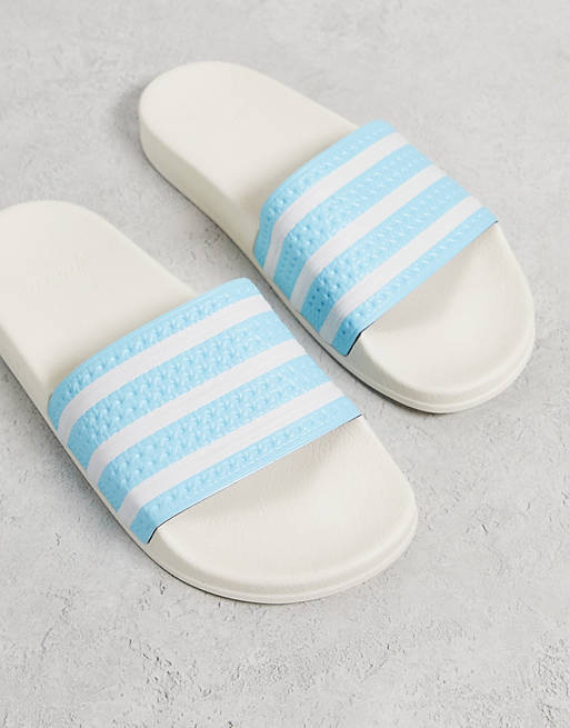zacht Tegen de wil Konijn adidas Originals - Adilette - Slippers in gebroken wit en blauw | ASOS