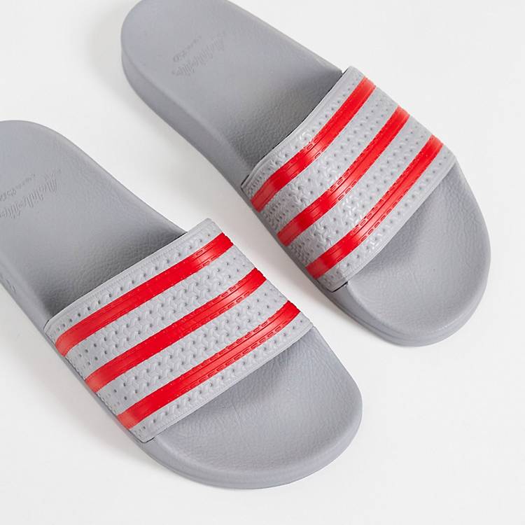 Noordoosten bijwoord Grondig adidas Originals - Adilette - Slippers in grijs en rood | ASOS