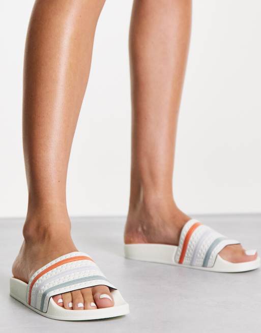 adidas Originals Adilette terry towelling sliders in off white with coloured three stripes