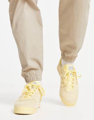 adidas Originals AS520 trainers in pastel yellow ASOS