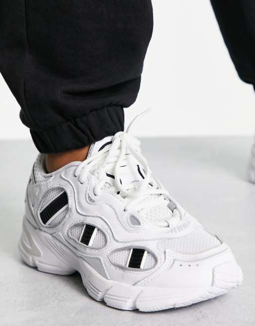 adidas Originals Astir SN trainers in white and black