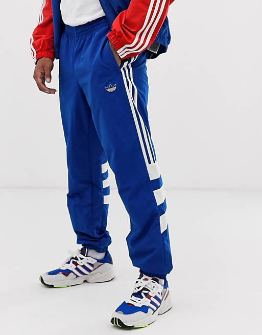 adidas Originals Balanta joggers with 3 stripes and panelling in blue ...