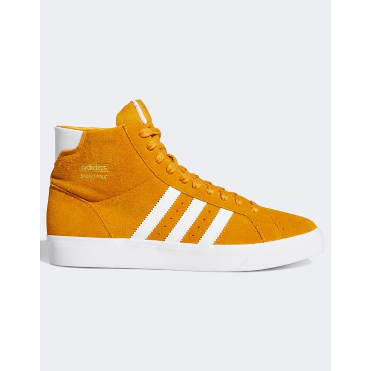 Black and yellow adidas best sale high tops