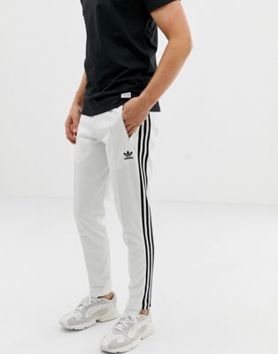 pantaloni adidas strisce bianche