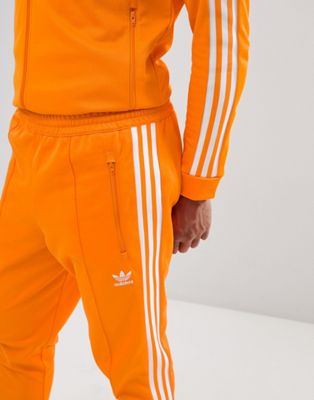 survetement adidas homme noir et orange