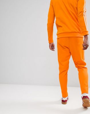 adidas beckenbauer pants orange