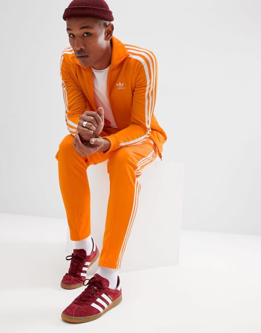 Orange adidas shop track suit