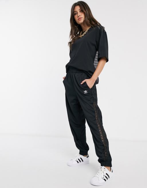 adidas Originals Bellista lace insert track pants in black ASOS
