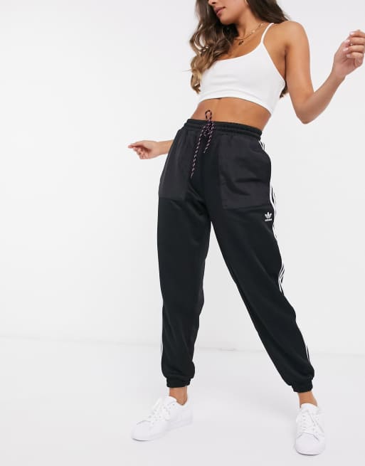 Adidas originals bellista three stripe cuffed joggers in black hotsell