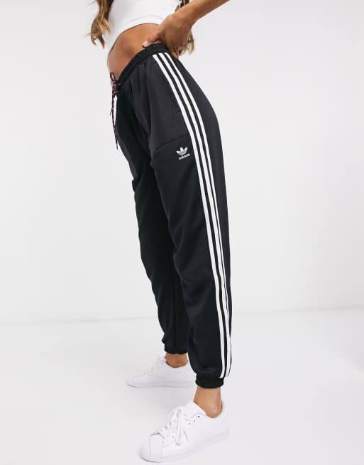 Adidas originals bellista three stripe cuffed joggers in black hotsell