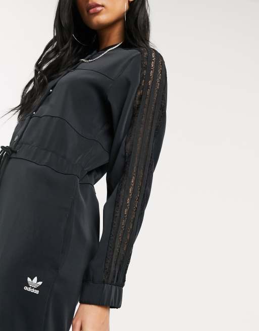 Tuta adidas nera store con bottoni laterali