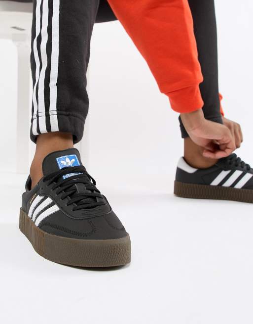 Black and white 2025 adidas with gum sole