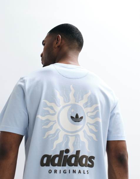 adidas Originals - Camiseta azul con estampado de sol en la espalda - view 1