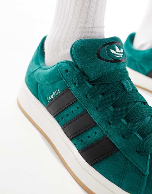 Black adidas with outlet green stripes