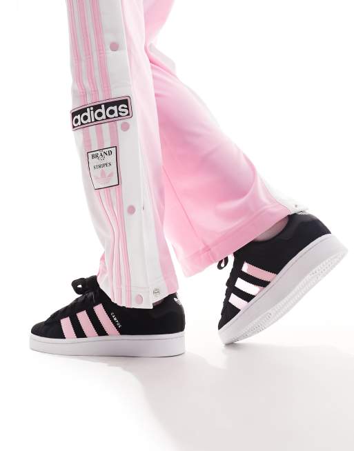 Black trainers with pink stripes sale