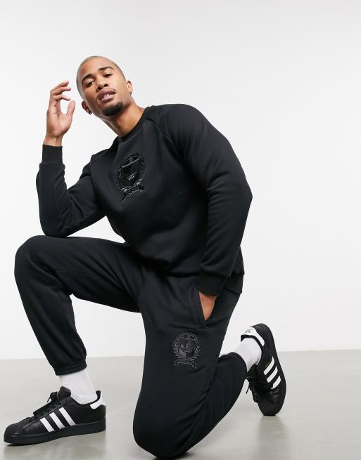 Nervesammenbrud hellig slump adidas Originals co-ord joggers with collegiate crest in black fleece | ASOS