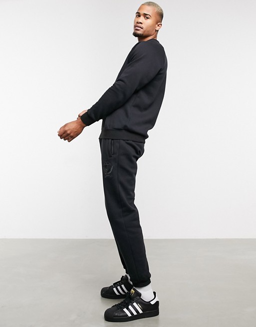 adidas Originals co-ord joggers with collegiate crest in black fleece