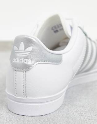 adidas white shoes with silver stripes