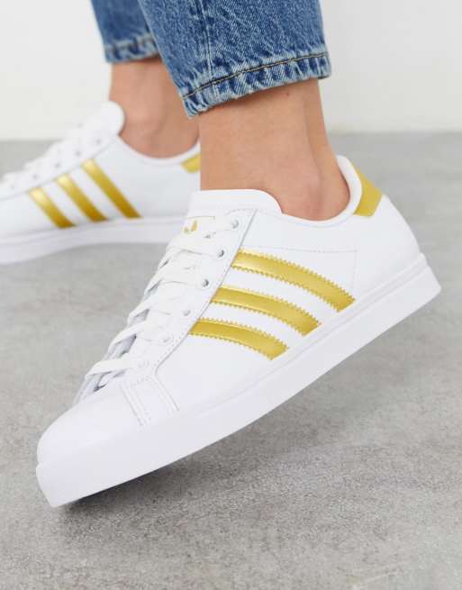 Adidas superstar bianche store strisce oro