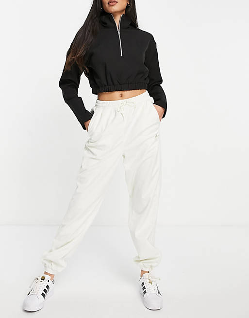 adidas Originals 'Comfy Cords' velvet corduroy cuffed joggers in off white