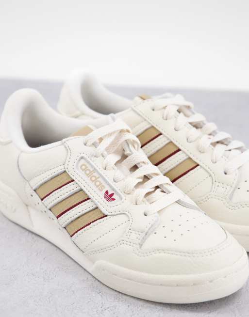 Scarpe adidas cheap strisce oro