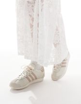 New Balance 1906 sneakers in white with blue and pink details