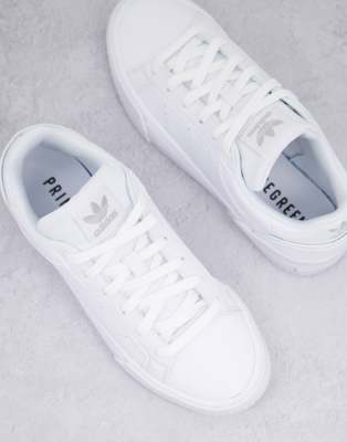 triple white adidas trainers