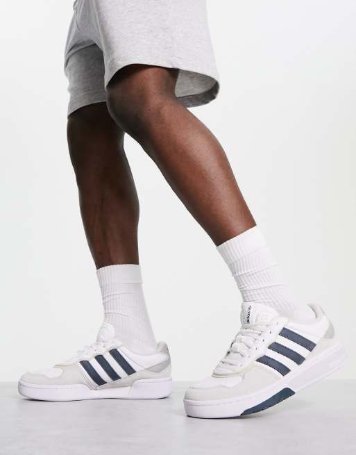 adidas Originals Courtic sneakers in white and navy