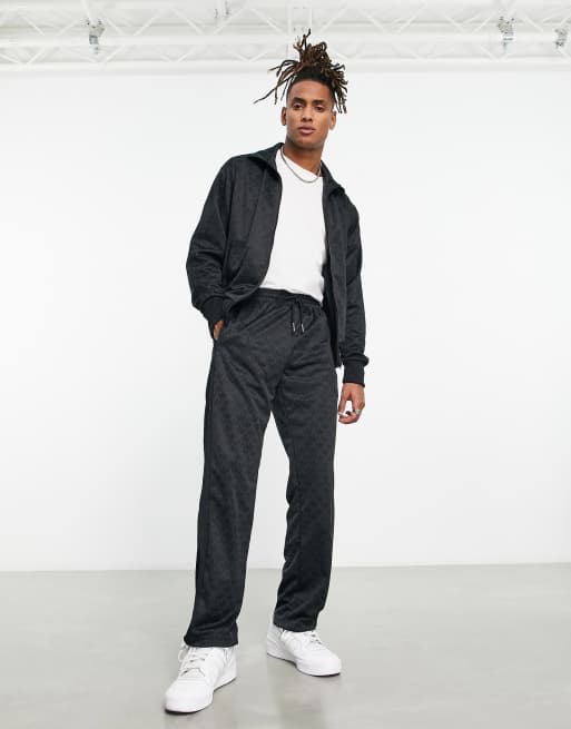 adidas Originals – Czarne spodnie dresowe we wzór z monogramem z logo Trefoil
