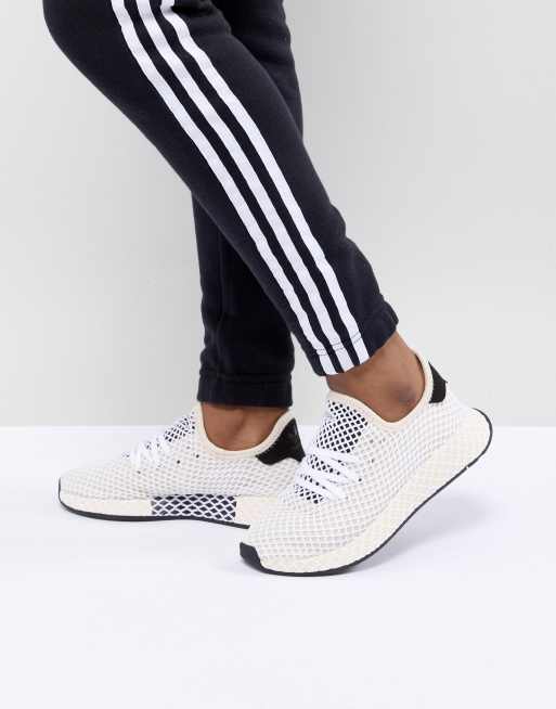 Adidas deerupt nere store bianche e oro