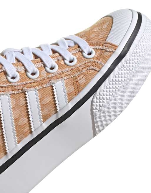 adidas Originals Disney Nizza Platform Mid trainers in beige ASOS