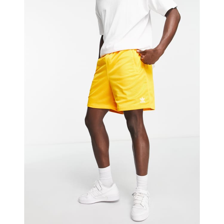 adidas Essentials style shorts collegiate gold | ASOS