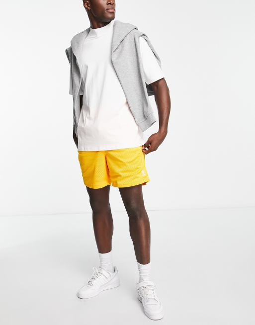 adidas Originals Essentials basketball style shorts in collegiate gold