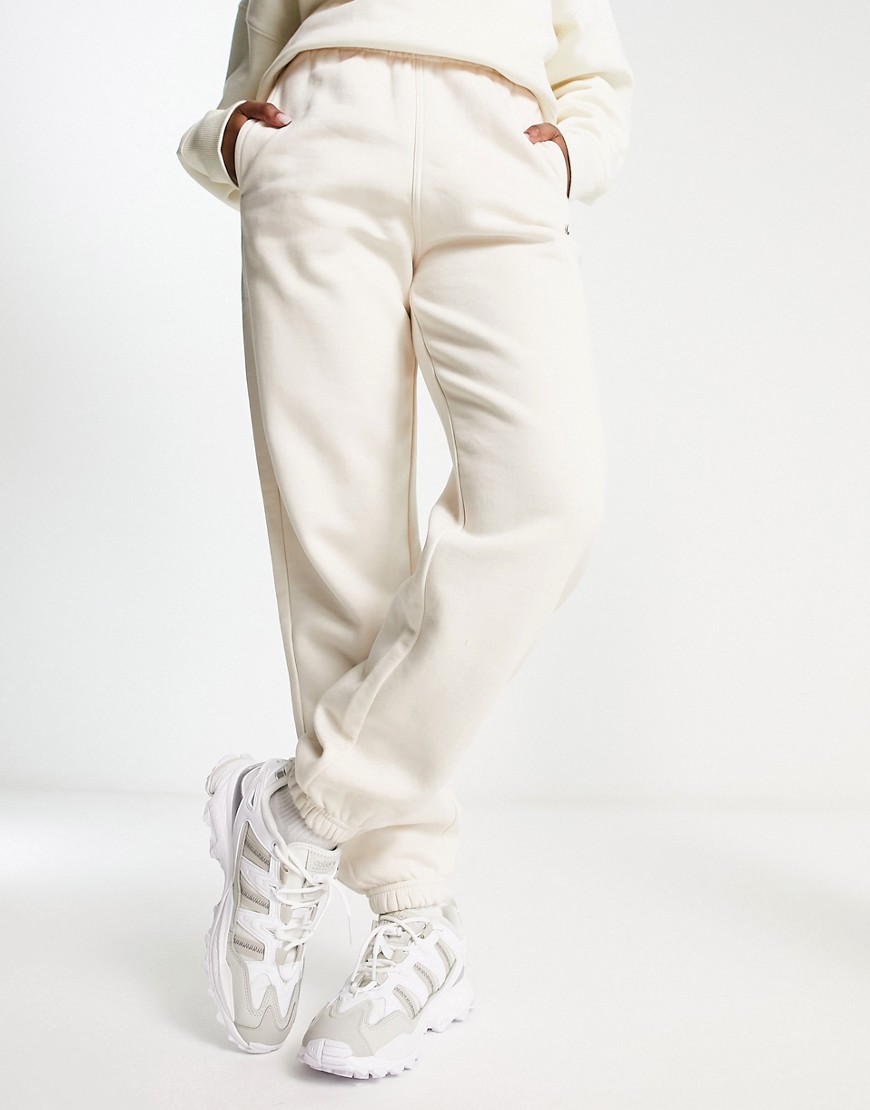adidas Originals essentials fleece joggers in off white