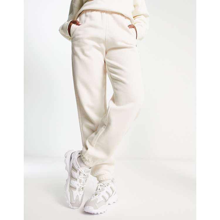 adidas Originals essentials fleece joggers in off white